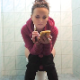 Dressed for a chilly day, a pretty Bulgarian girl sits on a toilet while vaping, pissing and taking a shit. After gently pushing, plops are heard at 2:14 into the clip. Some farts is heard later as well. Presented in 720P HD. About 8.5 minutes.